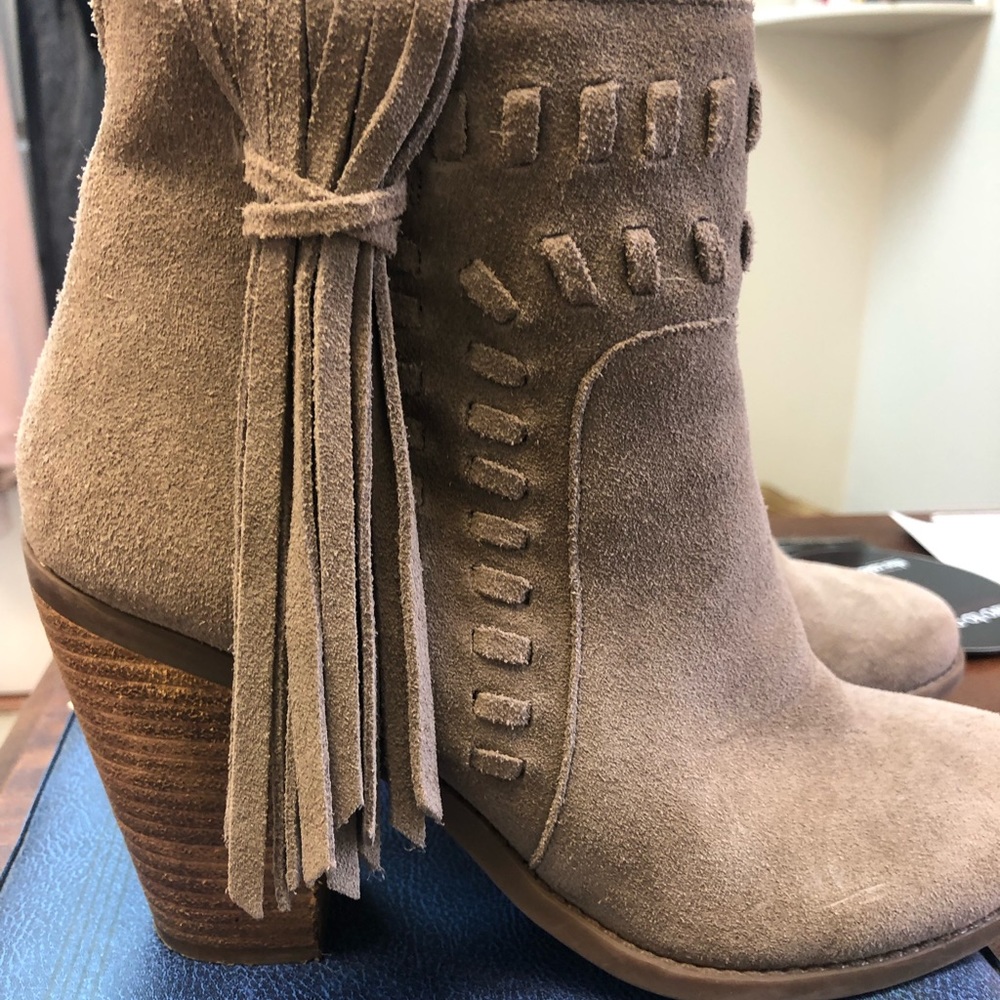 Boots with fringe accent